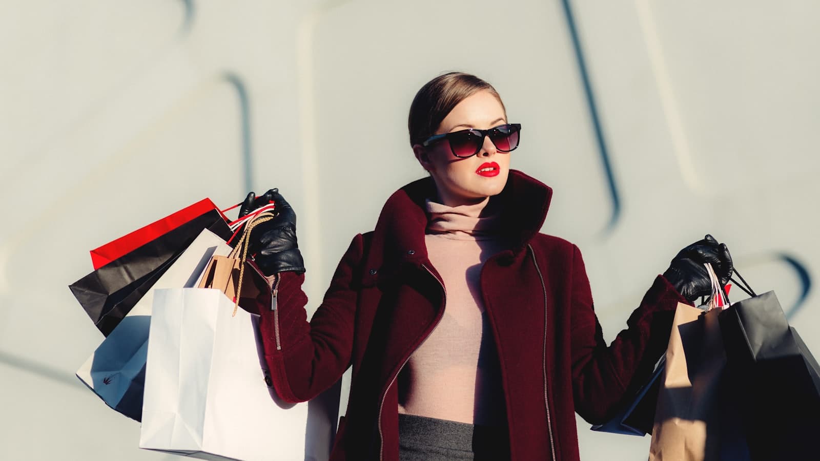 Shopper carrying paper shopping bags